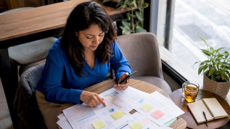 Marketer reviewing call tracking reports at desk