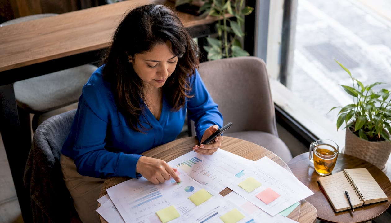 Marketer reviewing call tracking reports at desk
