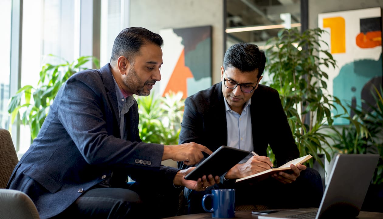 Professionals discussing call tracking services in office