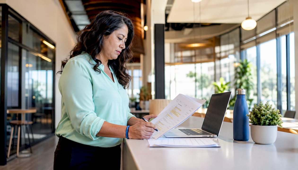 Businesswoman reviewing SEO audit report in office