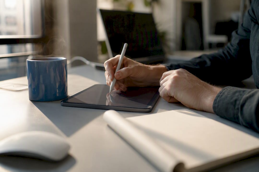Hands creating URL redirect spreadsheet