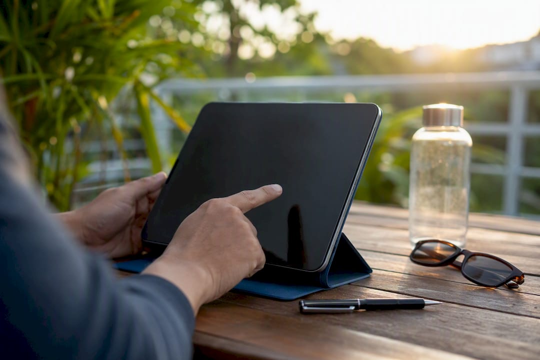 Hands interacting with smartphone for PPC reporting