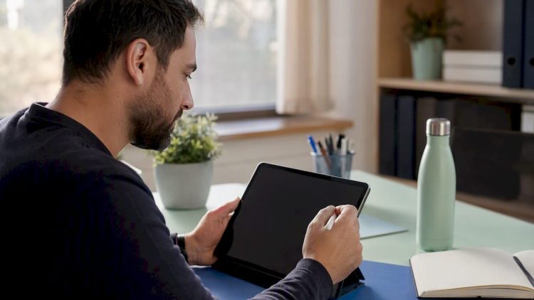 Hands submitting business profile appeal on tablet