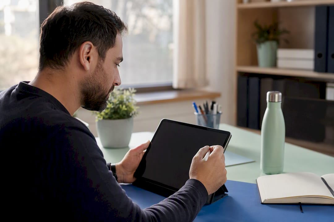 Hands submitting business profile appeal on tablet