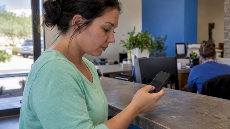 Owner testing a mobile call button